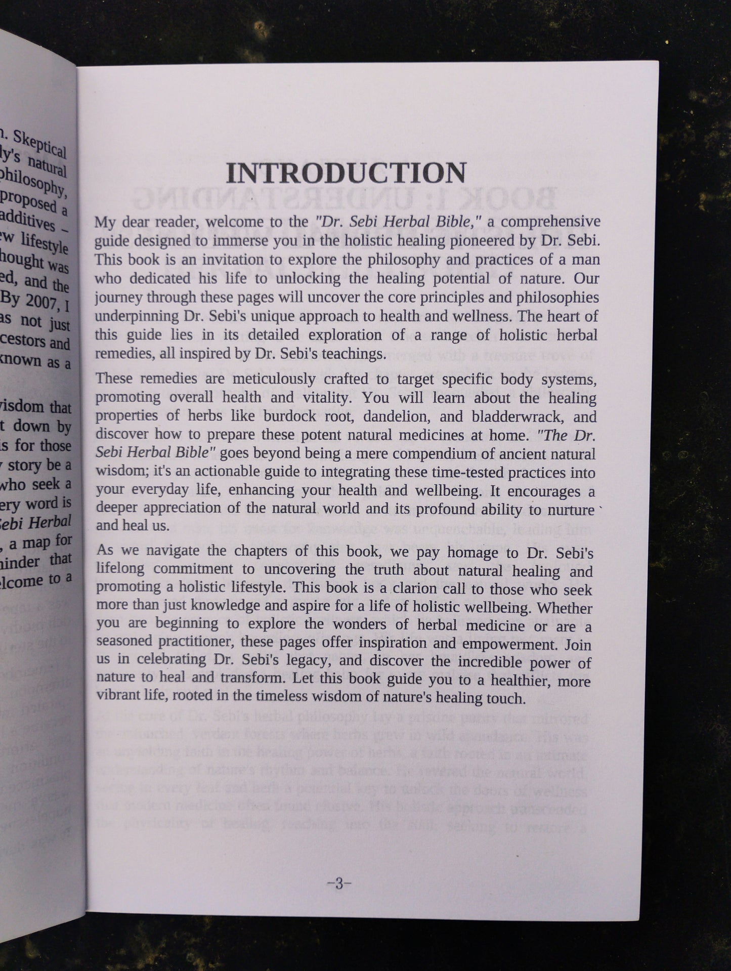 Open book with an introduction page on a dark background