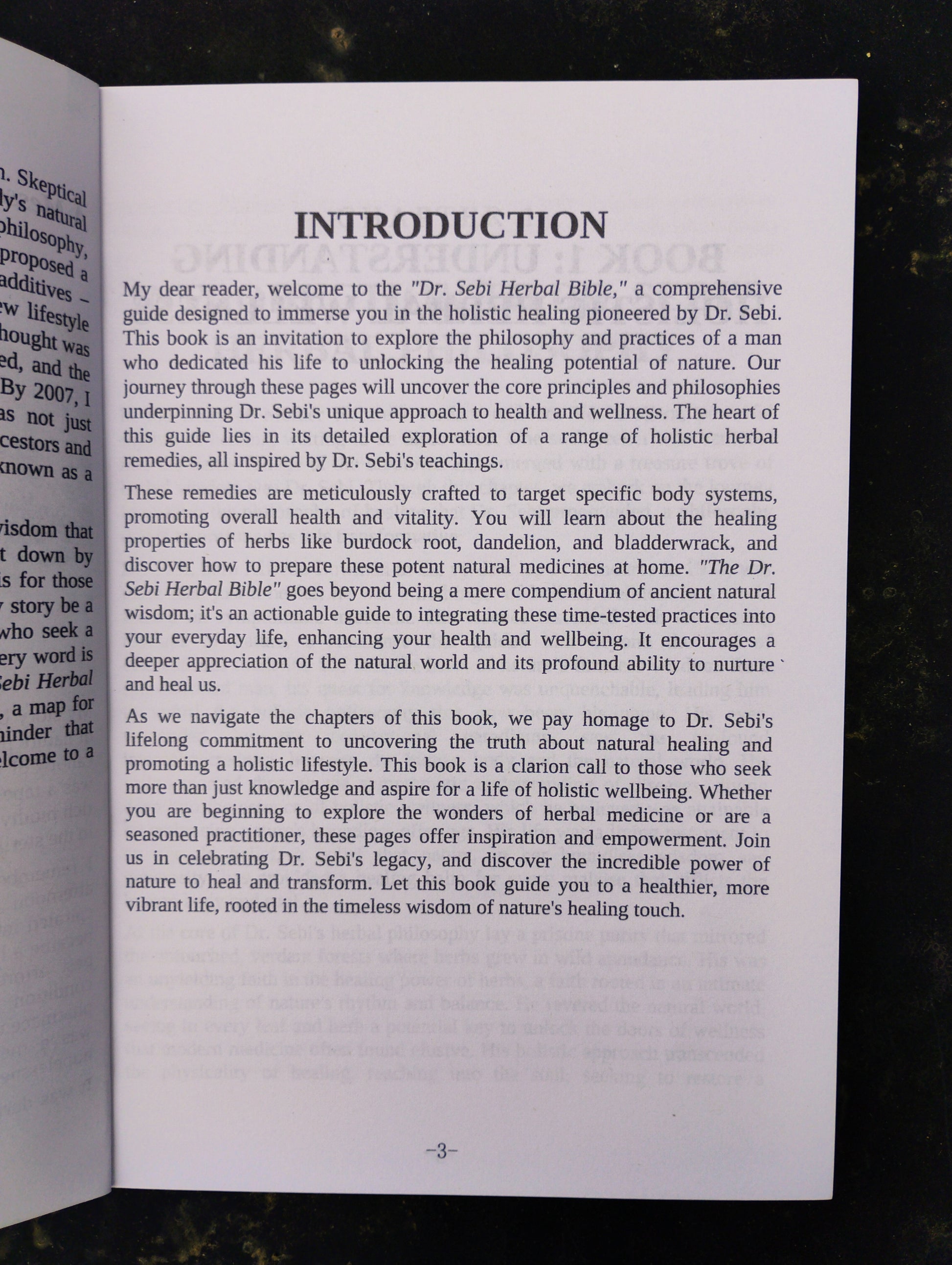 Open book with an introduction page on a dark background