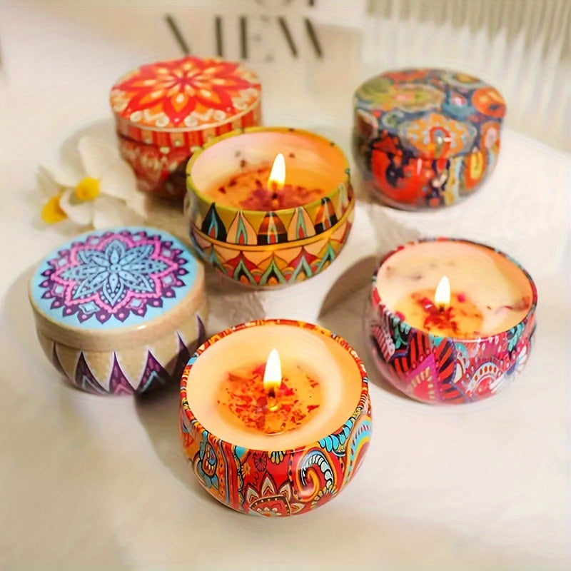 Colorful candles with intricate patterns on a light surface