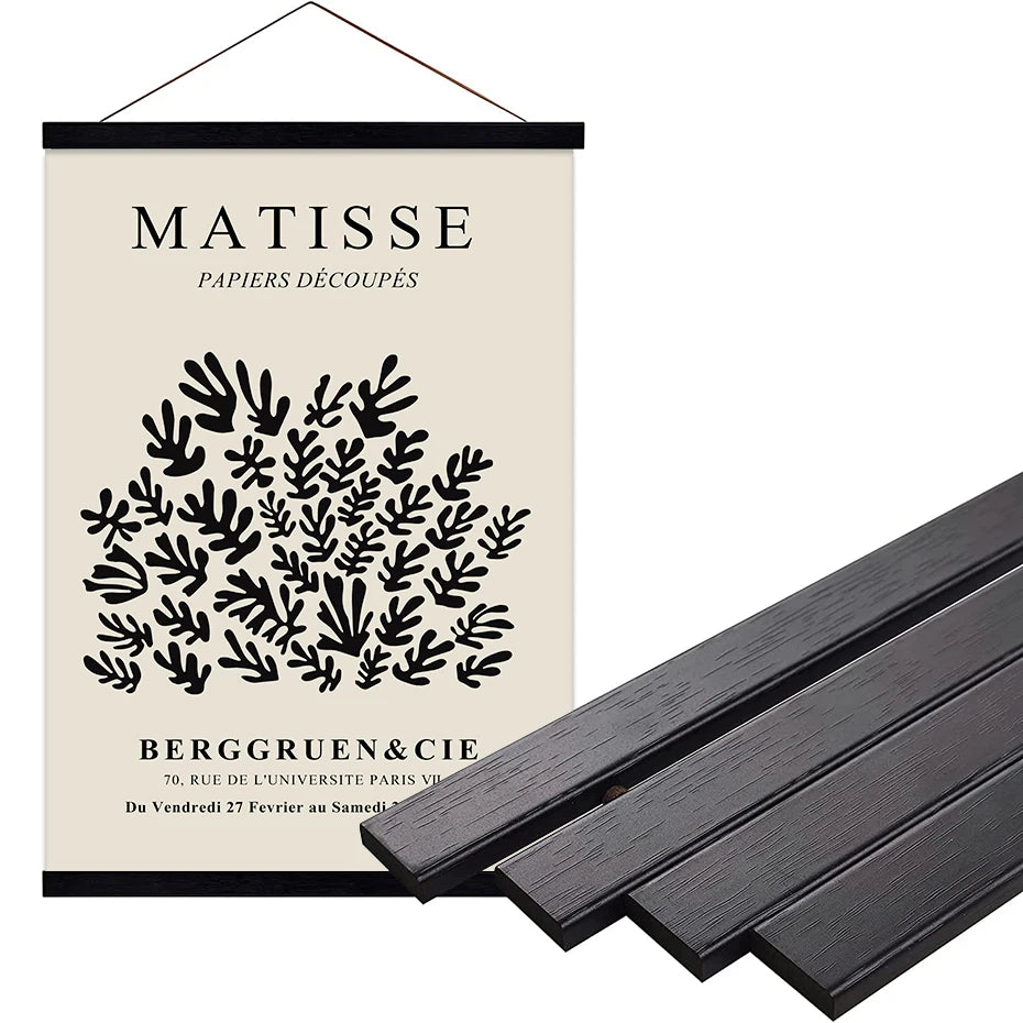 Poster with black and white design and text on a beige background, accompanied by dark wooden slats.