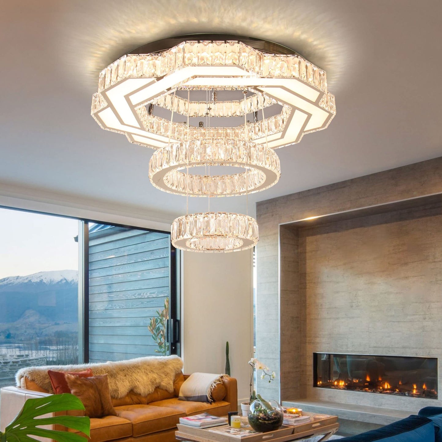 Modern living room with a stylish chandelier, sectional sofa, and fireplace.